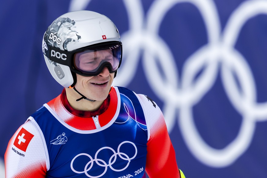 Switzerland's Marco Odermatt reacts in finish area during the men's alpine skiing first run of the giant slalom race at the 2026 Olympic Winter Games at the Stelvio Ski centre in Bormio, Ita ...