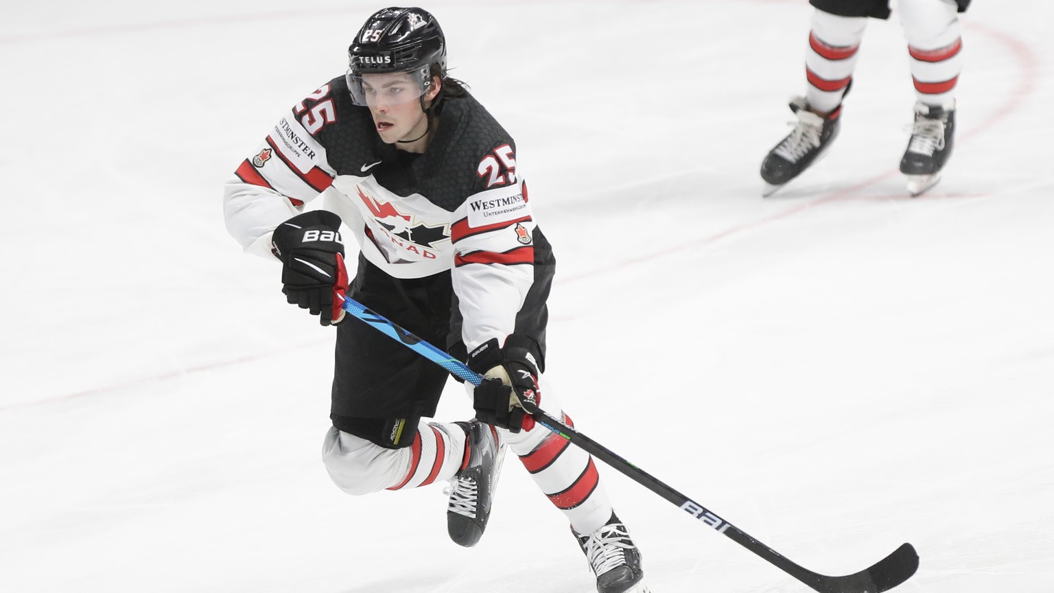 Canada&#039;s Owen Power controls the puck during the Ice Hockey World Championship semifinal match between the United States and Canada at the Arena in Riga, Latvia, Saturday, June 5, 2021. (AP Photo ...