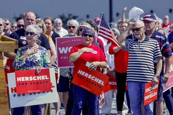 epa10168283 Supporters gather at a campaign rally for Republican US Senate candidate Herschel Walker at the Lakepoint Sports Park in Emerson, Georgia, USA, 07 September 2022. Walker is running against ...