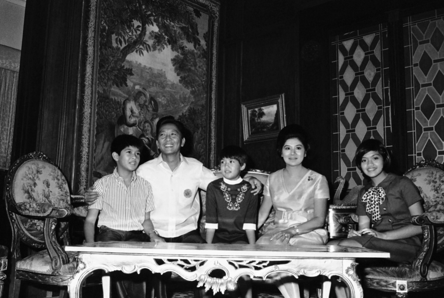 FILE - Philippines President Ferdinand Marcos and first lady Imelda sit with their children from left, Bongbong, Iren, and Immee, in November 1969, in Manila Philippines. Marcos Jr., son of the late d ...