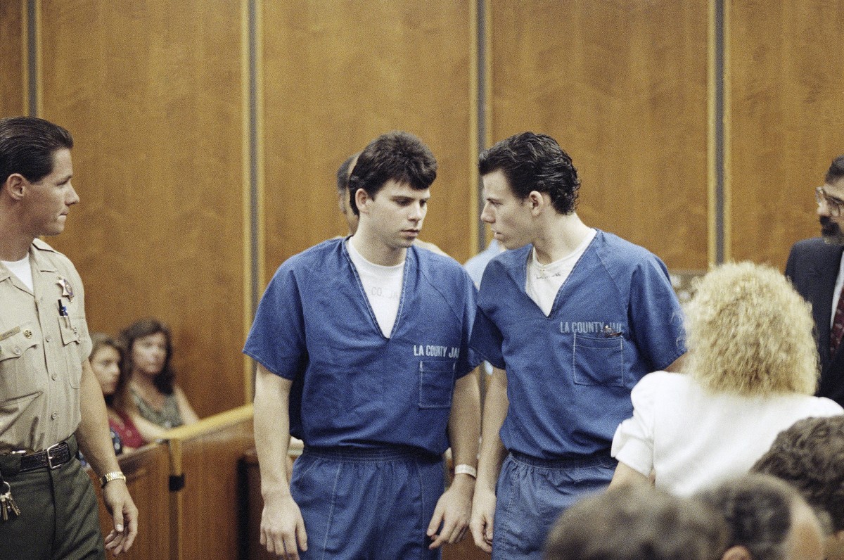 FILE - Lyle, left, and Erik Menendez leave a courtroom in Santa Monica, Calif., Aug. 6, 1990, after a judge ruled that conversations between the brothers and their psychologist after their parents wer ...