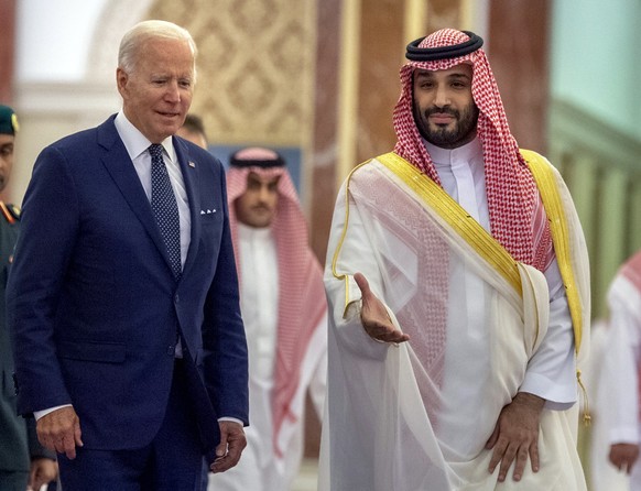 FILE - In this photo released by the Saudi Royal Palace, Saudi Crown Prince Mohammed bin Salman, right, welcomes U.S. President Joe Biden to Al-Salam Palace in Jeddah, Saudi Arabia, July 15, 2022. At  ...