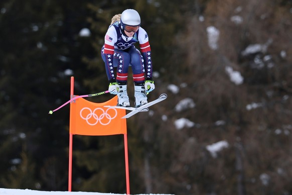 United States' Lindsey Vonn speeds down the course during an alpine ski, women's downhill official training, at the 2026 Winter Olympics, in Cortina d'Ampezzo, Italy, Friday, Feb. 6, 20 ...