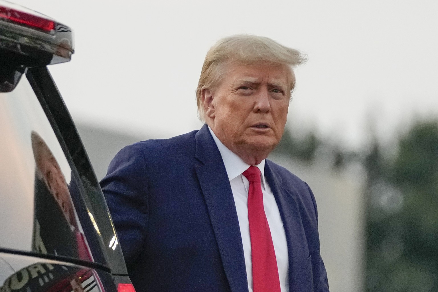 Former President Donald Trump walks to speak with reporters before departure from Hartsfield-Jackson Atlanta International Airport, Thursday, Aug. 24, 2023, in Atlanta. (AP Photo/Alex Brandon)
Donald  ...