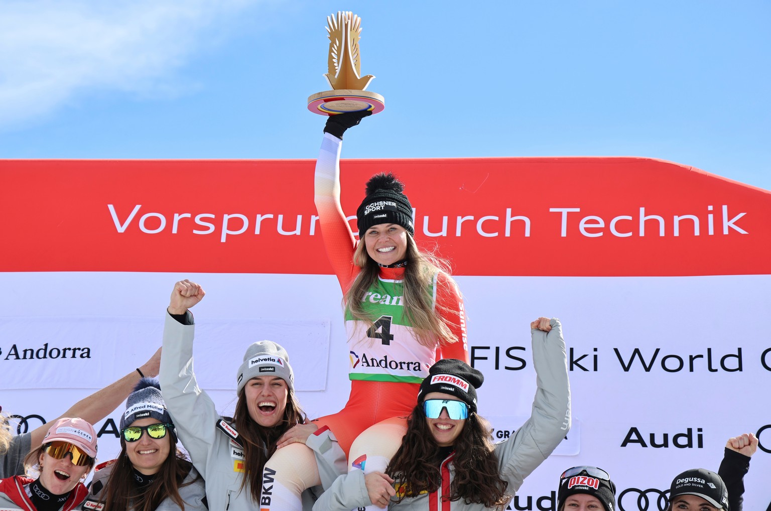 Switzerland's Corinne Suter celebrates with the team after winning an alpine ski, women's World Cup downhill, in Soldeu, Andorra, Friday, February. 27, 2026. (AP Photo/Marco Trovati)
Corinne ...