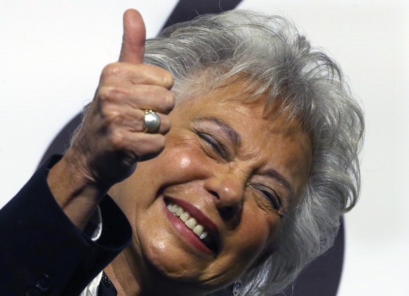 In this Dec. 14, 2017 photo, Olga Sanchez Cordero gives a thumbs up during a ceremony at which presidential candidate Andres Manuel Lopez Obrador announced his cabinet members, naming her interior sec ...