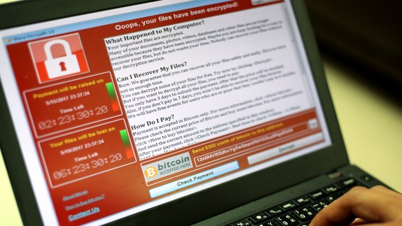 epa05960674 A programer shows a sample of a ransomware cyberattack on a laptop in Taipei, Taiwan, 13 May, 2017. According to news reports, a &#039;WannaCry&#039; ransomware cyber attack hits thousands ...