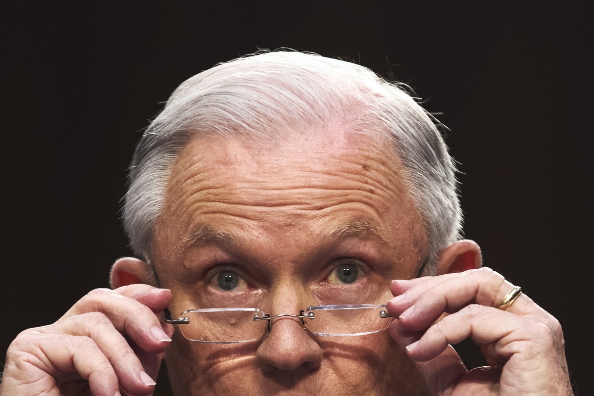 epa07149116 (FILE) - US Attorney General Jeff Sessions puts on his glasses while testifying before the Senate Intelligence Committee on the FBI's investigation into the Trump administration, and  ...