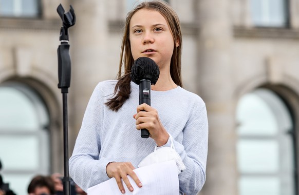 epa09485641 Swedish climate activist Greta Thunberg delivers a speech at the Fridays For Future global climate action day in Berlin, Germany, 24 September 2021. Climate activists of Fridays For Future ...