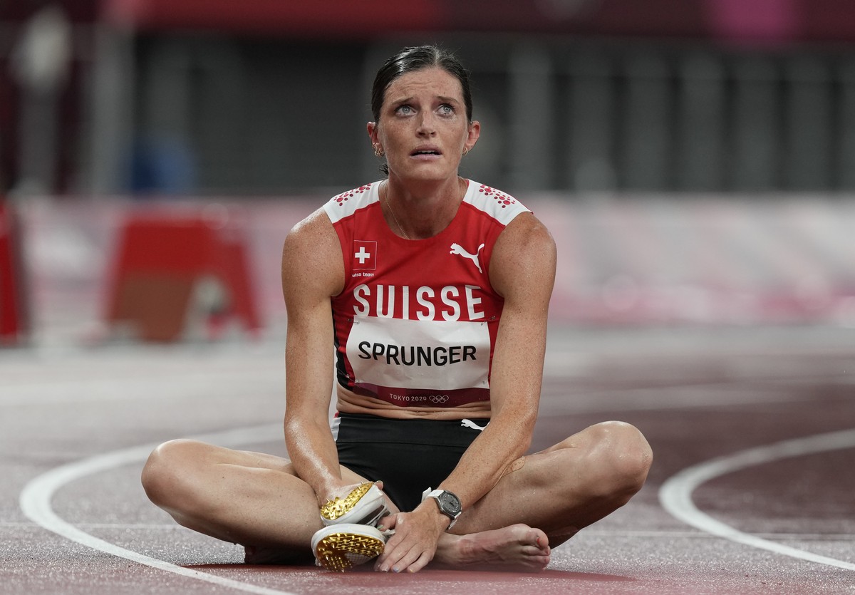 Lea Sprunger, of Switzerland reacts after a heat of the women's 400-meter hurdles at the 2020 Summer Olympics, Monday, Aug. 2, 2021, in Tokyo, Japan. (AP Photo/Martin Meissner)