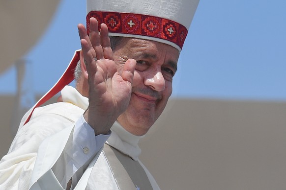 epa06450841 Bishop Juan Barros waves to the faithful after the Holy mass lead by Pope Francis at Lobito Campos, IIquique, Chile, 18 January 2018. Pope Francis visits in Chile and Peru runs from 15 Jan ...