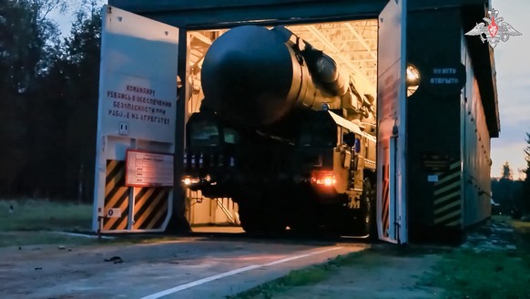 In this photo released by Russian Defense Ministry Press Service on Monday, July 22, 2024, a Yars intercontinental ballistic missile launcher rolls from an hangar during a military exercise near Yoshk ...