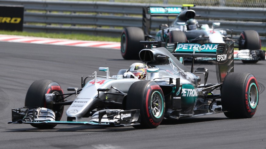 Mercedes driver Lewis Hamilton of Britain leads ahead of Mercedes driver Nico Rosberg of Germany during the Hungarian Formula One Grand Prix, at the Hungaroring racetrack, in Budapest, Hungary, Sunday ...