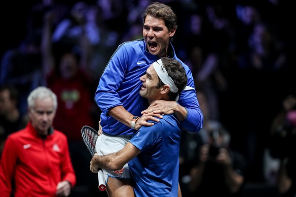 epa06224920 Switzerland&#039;s Roger Federer (down) and Spain&#039;s Rafael Nadal of the Team Europe celebrate after winning the Laver Cup tennis tournament in Prague, Czech Republic, 24 September 201 ...
