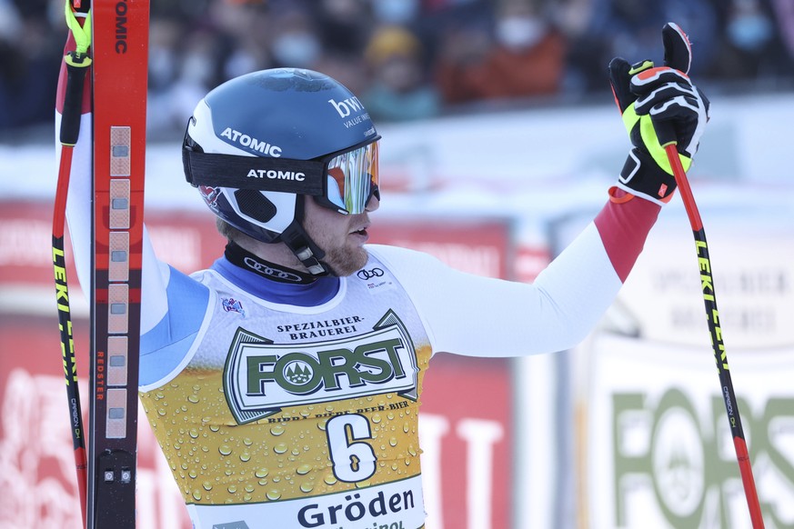 Switzerland&#039;s Niels Hintermann reacts after completing the course during an alpine ski, men&#039;s World Cup downhill race, in Val Gardena, Italy, Saturday, Dec.18, 2021. (AP Photo/Alessandro Tro ...