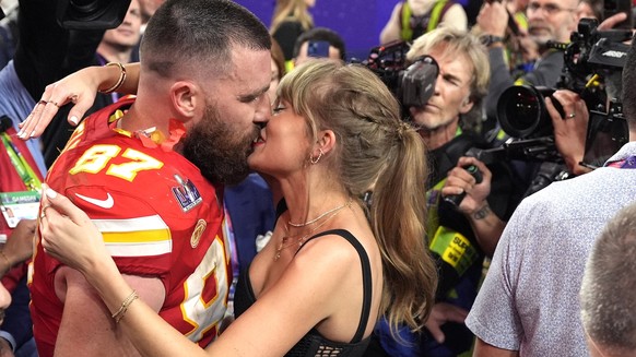 Taylor Swift kisses Kansas City Chiefs tight end Travis Kelce after the NFL Super Bowl 58 football game against the San Francisco 49ers, Sunday, Feb. 11, 2024, in Las Vegas. The Chiefs won 25-22. (AP  ...