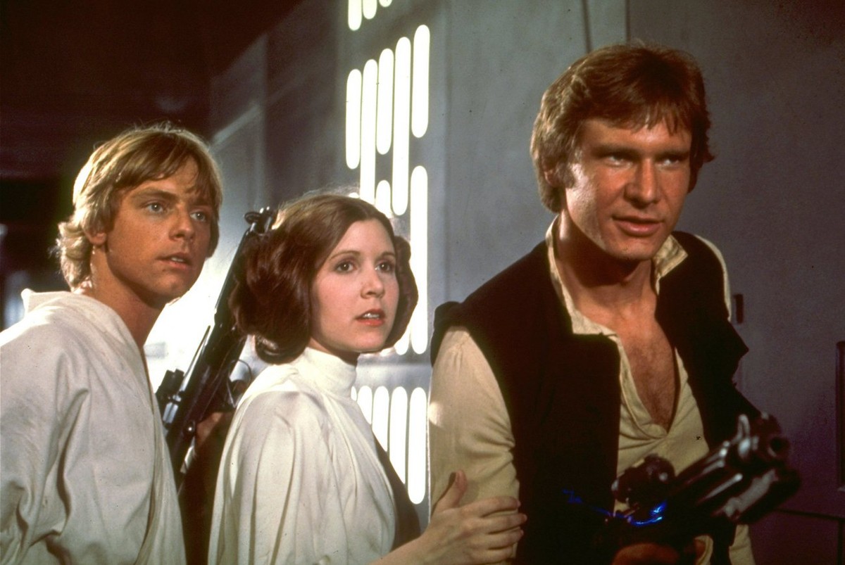 Mark Hamill, Carrie Fisher, and Harrison Ford (from left) appear in character in a scene from the 1977 film 'Star Wars'. Twenty years after its initial release, and two weeks after its reiss ...