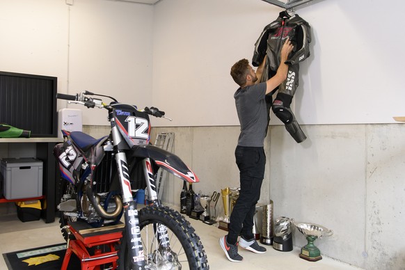 Swiss motorcycle racer Thomas &quot;Tom&quot; Luethi, hangs his motorcycle suits during a media appointment at his home in Linden, Switzerland, on Thursday, August. 19 2021. Luethi is retiring at the  ...