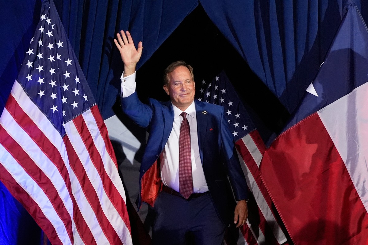 Texas Attorney General Ken Paxton, a Republican candidate for the U.S. Senate, waves as he takes the stage during a primary runoff election night event after winning the Republican party's nomina ...