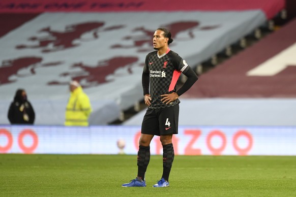 Liverpool's Virgil van Dijk gestures after Aston Villa's Ollie Watkins scores his side's second goal during the English Premier League soccer match between Aston Villa and Liverpool at ...