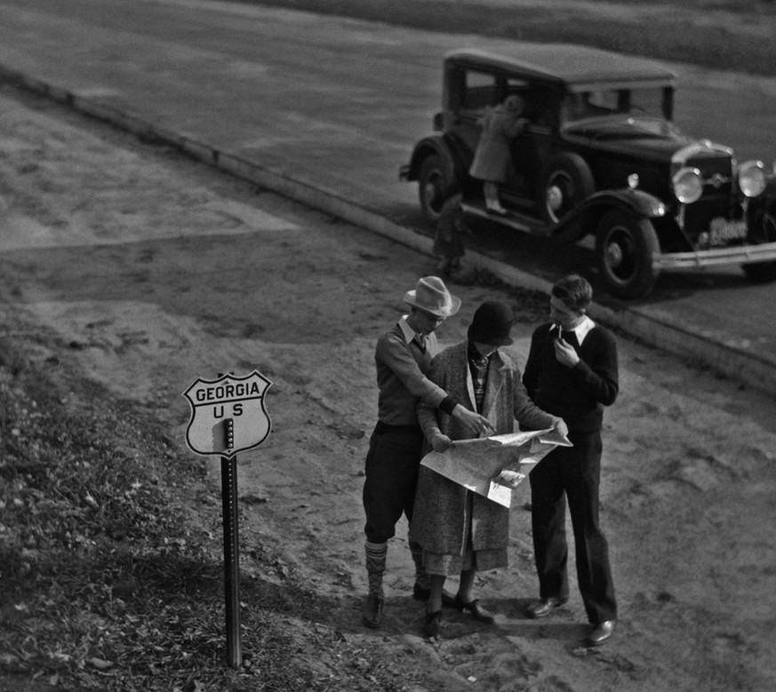 1930s: road trippers consult a map in the state of Georgia
The Great Depression shook the automobile industry, and car sales declined throughout this decade. However, those who could afford it still e ...
