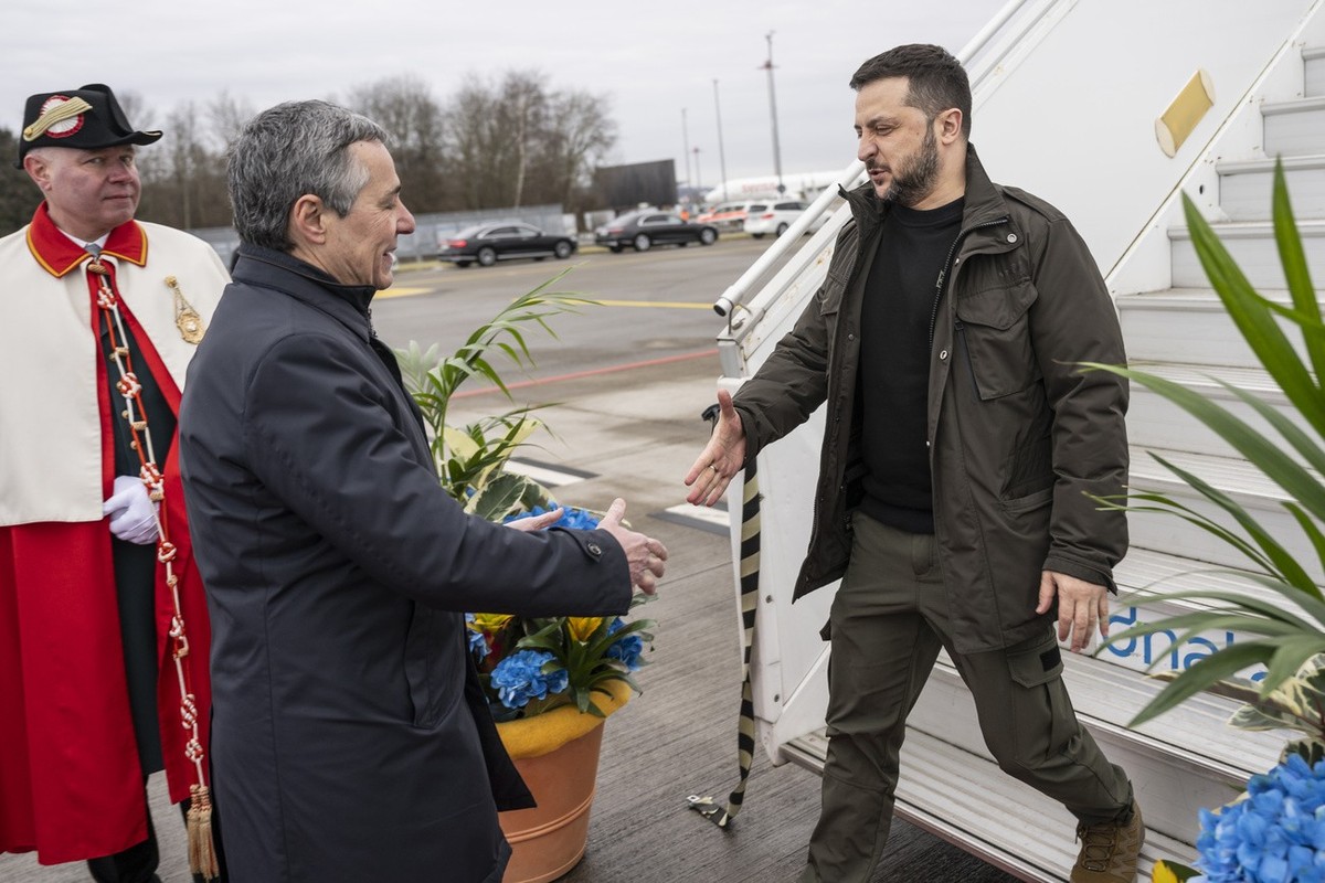 Switzerland's Foreign Minister Federal Councillor Ignazio Cassis, center, welcomes Volodymyr Zelenskyy, President of Ukraine, on Monday, January 15, 2024 on the Airport of Zurich Kloten, Switzerl ...