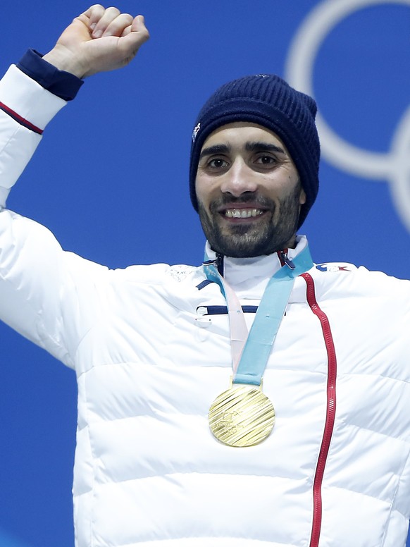 epa06542282 Gold medalist Martin Fourcade of France reacts during medal ceremony for the Men&#039;s Biathlon 15 km Mass Start race at the Alpensia Biathlon Centre during the PyeongChang 2018 Olympic G ...