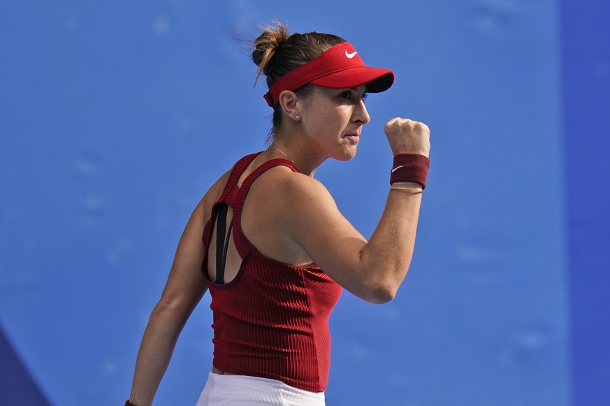 Belinda Bencic, of Switzerland, reacts after winning a set against Elena Rybakina, of Kazakhstan, during the semifinals of the tennis competition at the 2020 Summer Olympics, Thursday, July 29, 2021,  ...