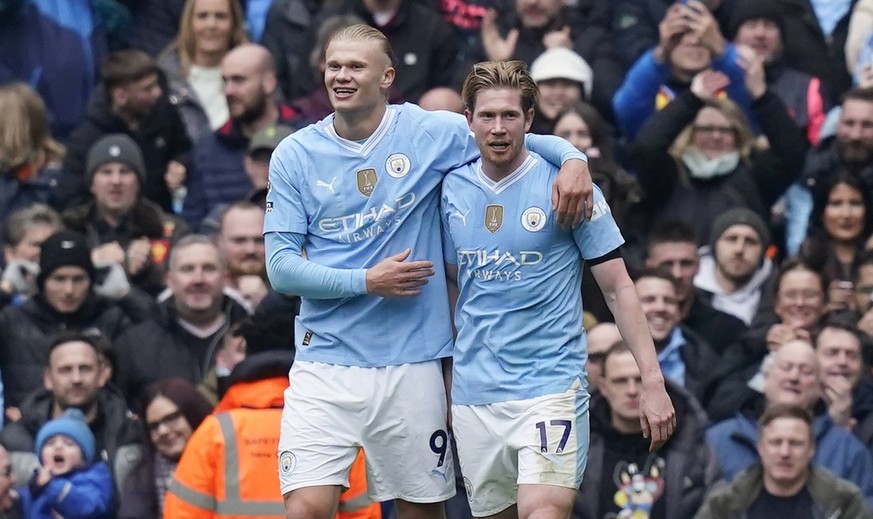 MANCHESTER, ENGLAND, 10th February 2024. Erling Haaland of Manchester City L celebrates after scoring the second goal with Kevin De Bruyne of Manchester City during the Premier League match at the Eti ...