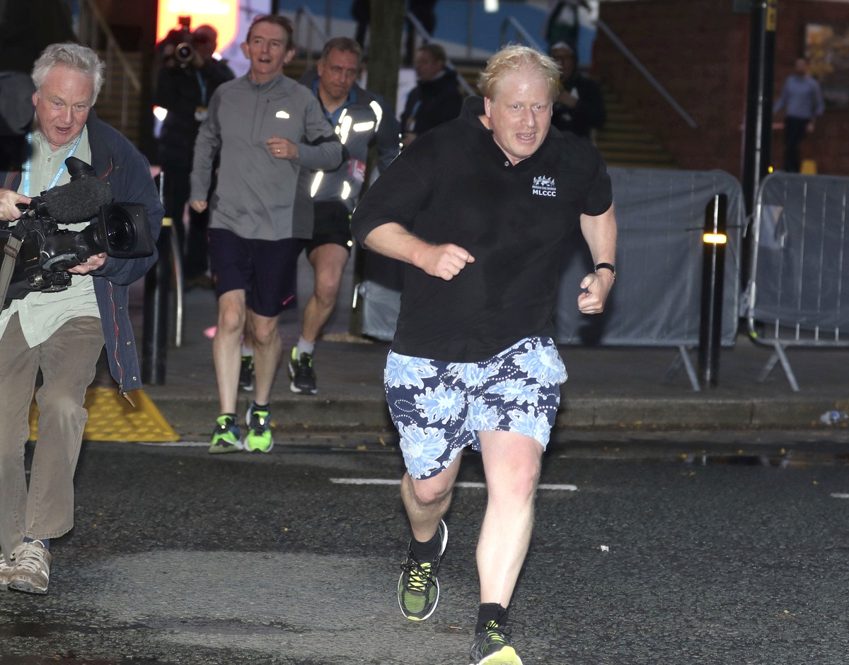 Britain's Foreign Secretary Boris Johnson goes for an early morning run while attending the Conservative Party Conference in Manchester, Tuesday Oct. 3, 2017. (Owen Humphreys/PA via AP)