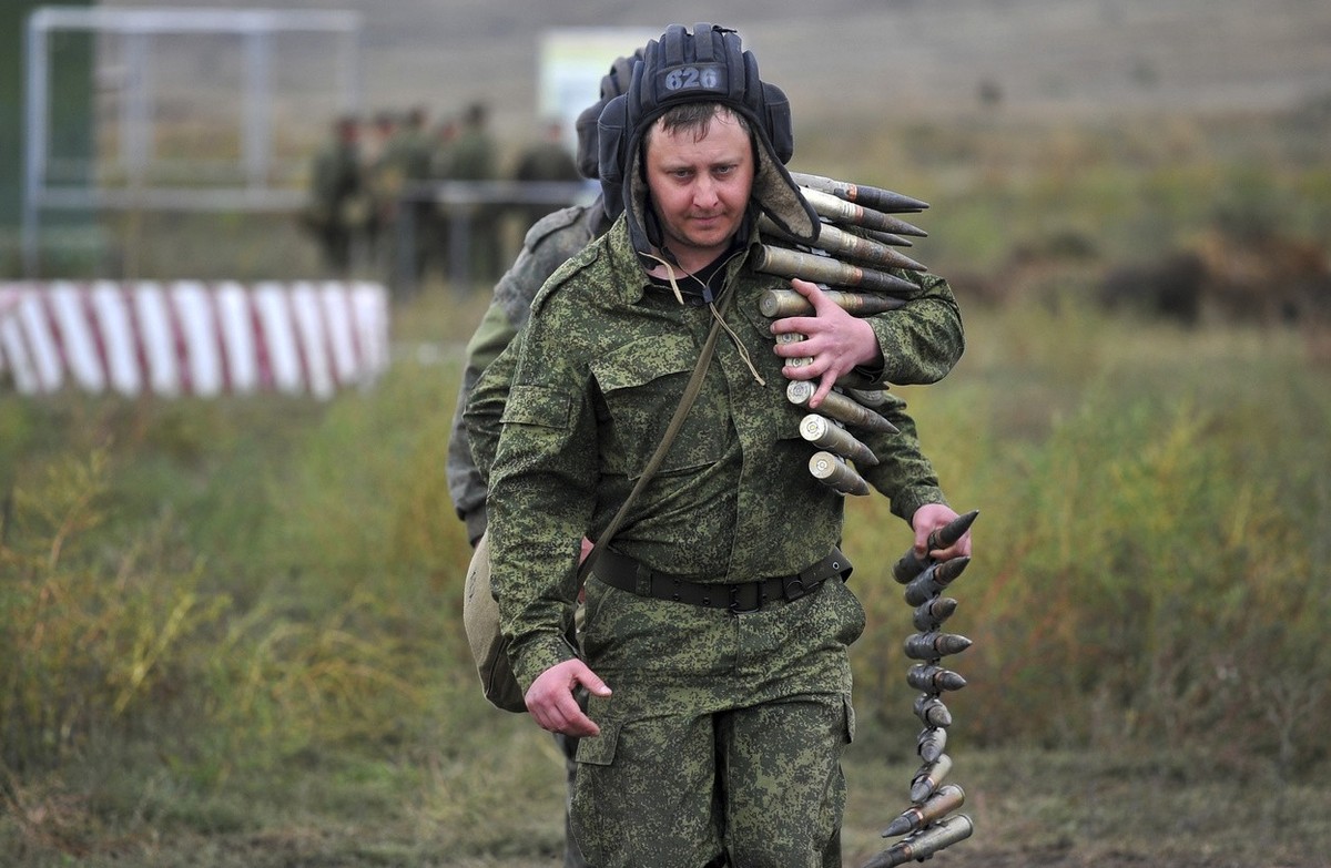 Recruits carry ammunition during a military training at a firing range in the Rostov-on-Don region in southern Russia, Tuesday, Oct. 4, 2022. Russian Defense Minister Sergei Shoigu said that the milit ...