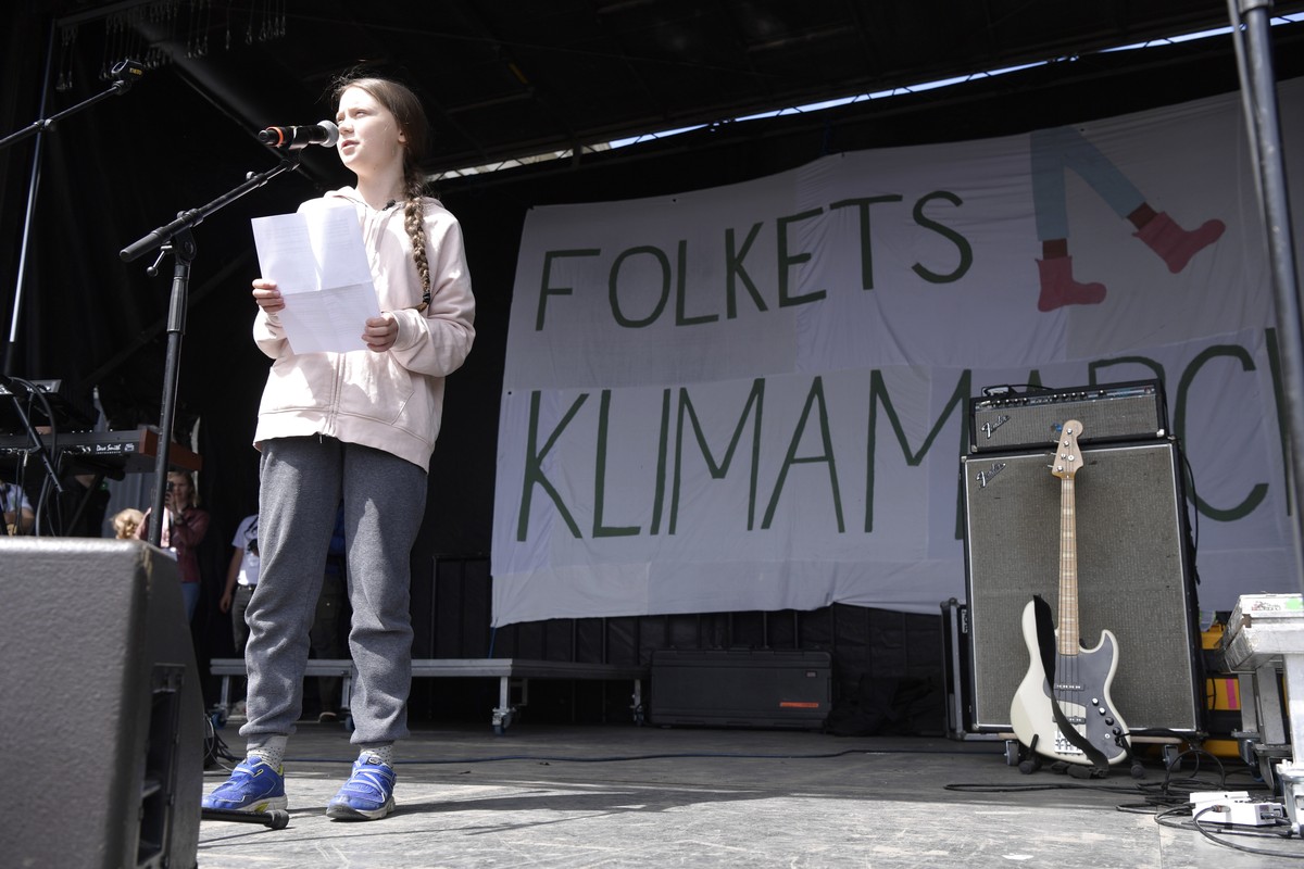 epa07599075 Swedish climate activist Greta Thunberg speaks during the People's Climate March (Folkets Klimamarch) in front of Christiansborg Palace, in Copenhagen, 25 May 2019. People across the  ...