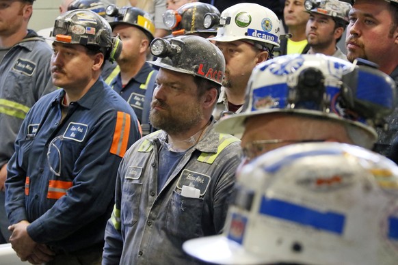 A group of coal miners listen to U.S. Environmental Protection Agency Administrator Scott Pruitt during his visit to Consol Pennsylvania Coal Company&#039;s Harvey Mine in Sycamore, Pa., Thursday, Apr ...