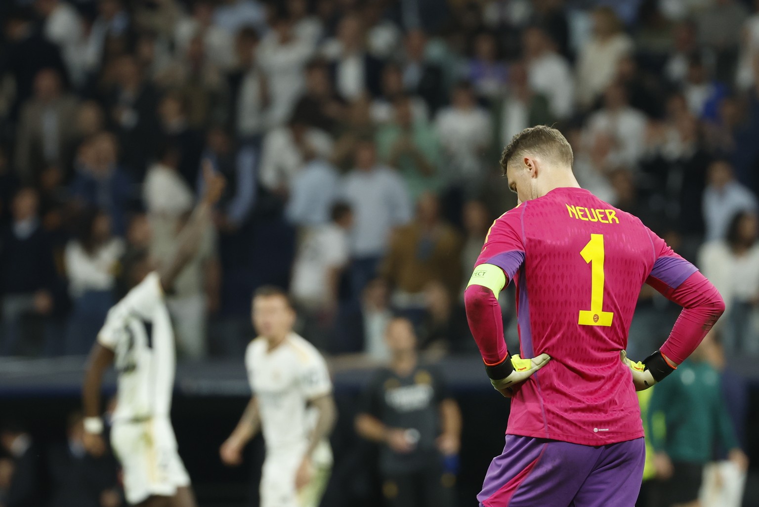 epa11327992 Bayern goalkeeper Manuel Neuer looks disappointed after conceding the 2-1 goal during the UEFA Champions League semifinal second leg soccer match between Real Madrid and Bayern Munich, in  ...