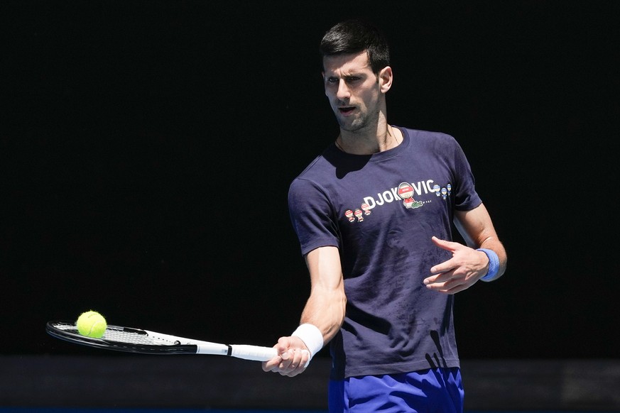 Defending men&#039;s champion Serbia&#039;s Novak Djokovic practices on Rod Laver Arena ahead of the Australian Open tennis championship in Melbourne, Australia, Wednesday, Jan. 12, 2022. AP Photo/Mar ...