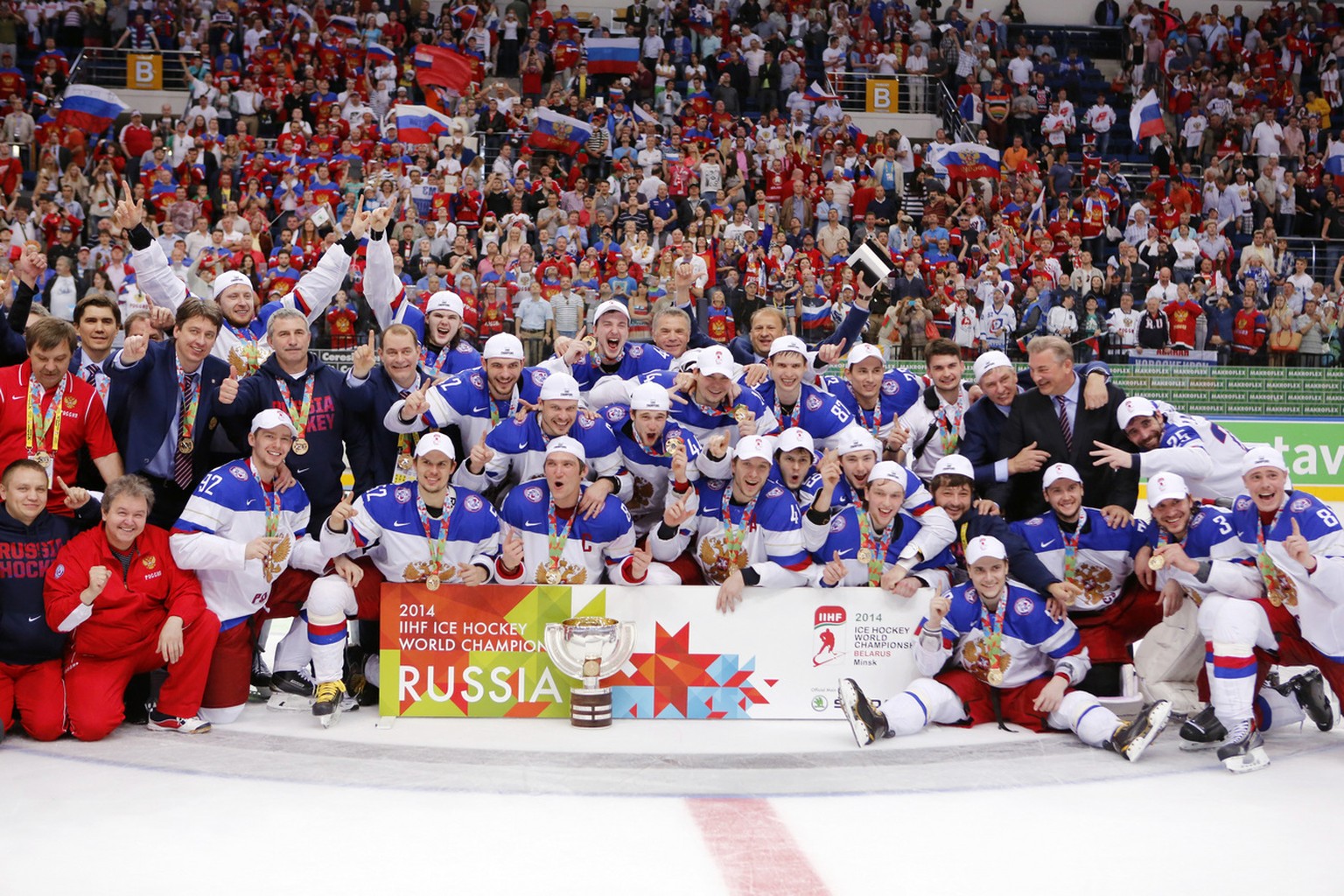 Russian players celebrate after Russia defeated Finland 5-2 in the gold medal match at the Ice Hockey World Championship in Minsk, Belarus, Sunday, May 25, 2014. (AP Photo/Darko Bandic)