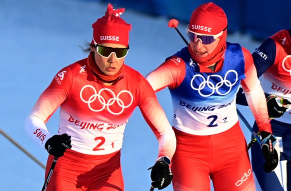 epa09761434 Laurien van der Graaff (L) and Nadine Faendrich of Switzerland in action in the Women&#039;s Team Sprint final at the Zhangjiakou National Cross-Country Skiing Centre at the Beijing 2022 O ...