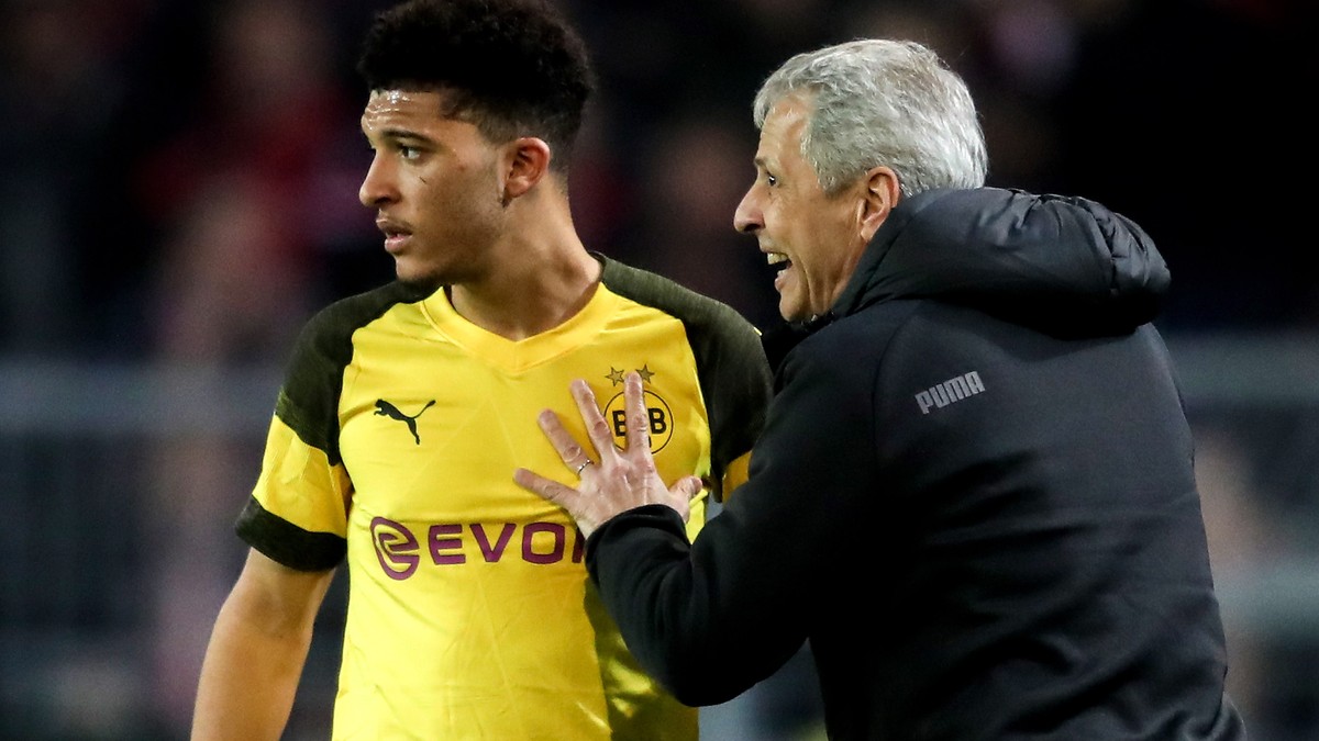 epa07393709 Dortmund's head coach Lucien Favre (R) gives advice to Dortmund's Jadon Sancho (L) during the German Bundesliga soccer match between Borussia Dortmund and Bayer Leverkusen in Dor ...
