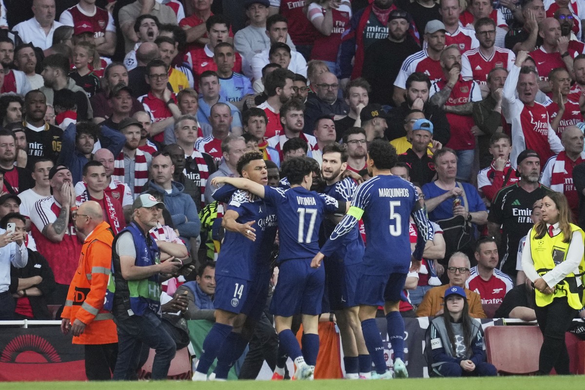PSG players celebrate after Ousmane Dembele scored the opening goal during the Champions League semifinal first leg soccer match between Arsenal and Paris Saint-Germain at Arsenal Stadium in London, E ...