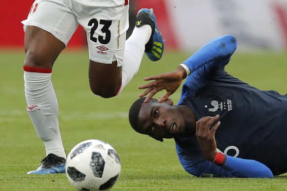 France&#039;s Paul Pogbais tackled by Peru&#039;s Pedro Aquino during the group C match between France and Peru at the 2018 soccer World Cup in the Yekaterinburg Arena in Yekaterinburg, Russia, Thursd ...