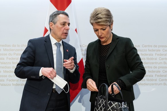 epa09791958 Swiss Federal President Ignazio Cassis (L), and Federal Councillor Karin Keller Sutter (Federal Department of Justice and Police - FDJP), arrive at a media conference to announce that Swit ...