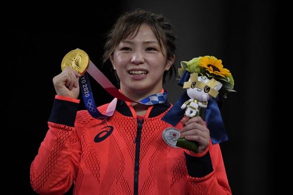 Gold medalist, Japan&#039;s Yukako Kawai celebrates on the podium during the medal ceremony for the women&#039;s 62kg Freestyle wrestling at the 2020 Summer Olympics, Wednesday, Aug. 4, 2021, in Chiba ...