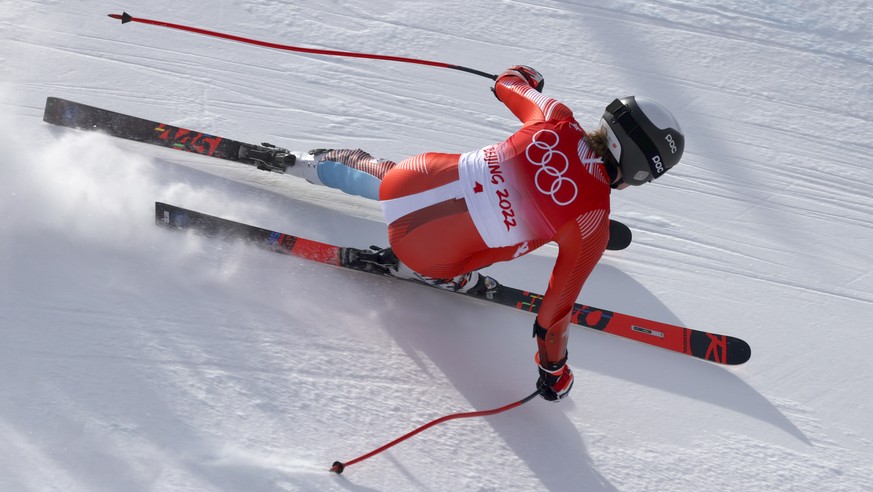 Michelle Gisin, of Switzerland makes a turn during the women&#039;s super-G at the 2022 Winter Olympics, Friday, Feb. 11, 2022, in the Yanqing district of Beijing. (AP Photo/Alessandro Trovati)