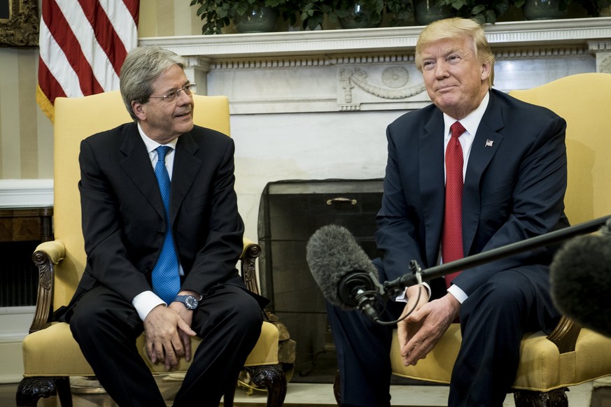 epa05918179 US President Donald J. Trump meets with Prime Minister Paolo Gentiloni of Italy in the Oval Office of the White House in Washington, DC, USA, 20 April 2017. Trump and Gentiloni are meeting ...