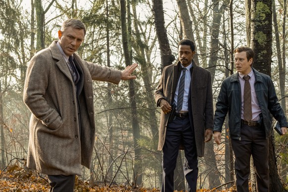 This image released by Lionsgate shows Daniel Craig, from left, Lakeith Stanfield and Noah Segan in a scene from &quot;Knives Out.&quot; Craig will return as Detective Benoit Blanc in