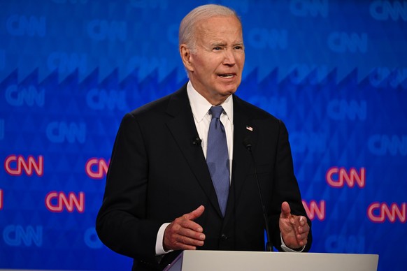 epa11442522 US President Joe Biden participates in the first 2024 presidential election debate with former US President Donald J. Trump at Georgia Institute of Technology?s McCamish Pavilion in Atlant ...