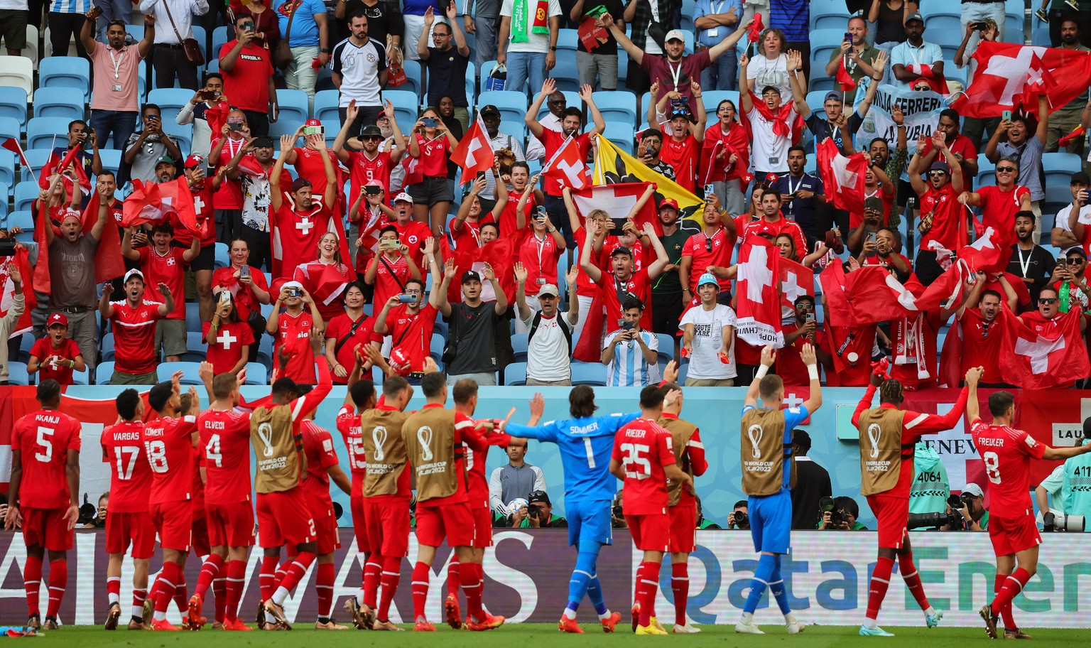 epa10324664 Players of Switzerland celebrate with fans after winning the FIFA World Cup 2022 group G soccer match between Switzerland and Cameroon at Al Janoub Stadium in Al Wakrah, Qatar, 24 November ...