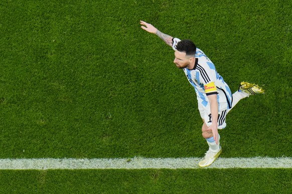 Argentina&#039;s Lionel Messi celebrates scoring his side&#039;s first goal with a penalty shot during the World Cup semifinal soccer match between Argentina and Croatia at the Lusail Stadium in Lusai ...