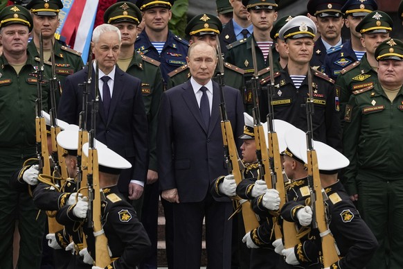 Russian President Vladimir Putin, centre, and Russian Defense Minister Andrei Belousov, centre left, attend a wreath-laying ceremony marking the 84th anniversary of the Nazi German invasion into Sovie ...