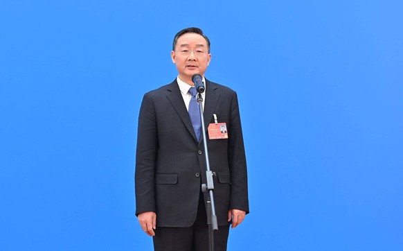 220305 -- BEIJING, March 5, 2022 -- Minister of Agriculture and Rural Affairs Tang Renjian attends an interview via video link after the opening meeting of the fifth session of the 13th National Peopl ...